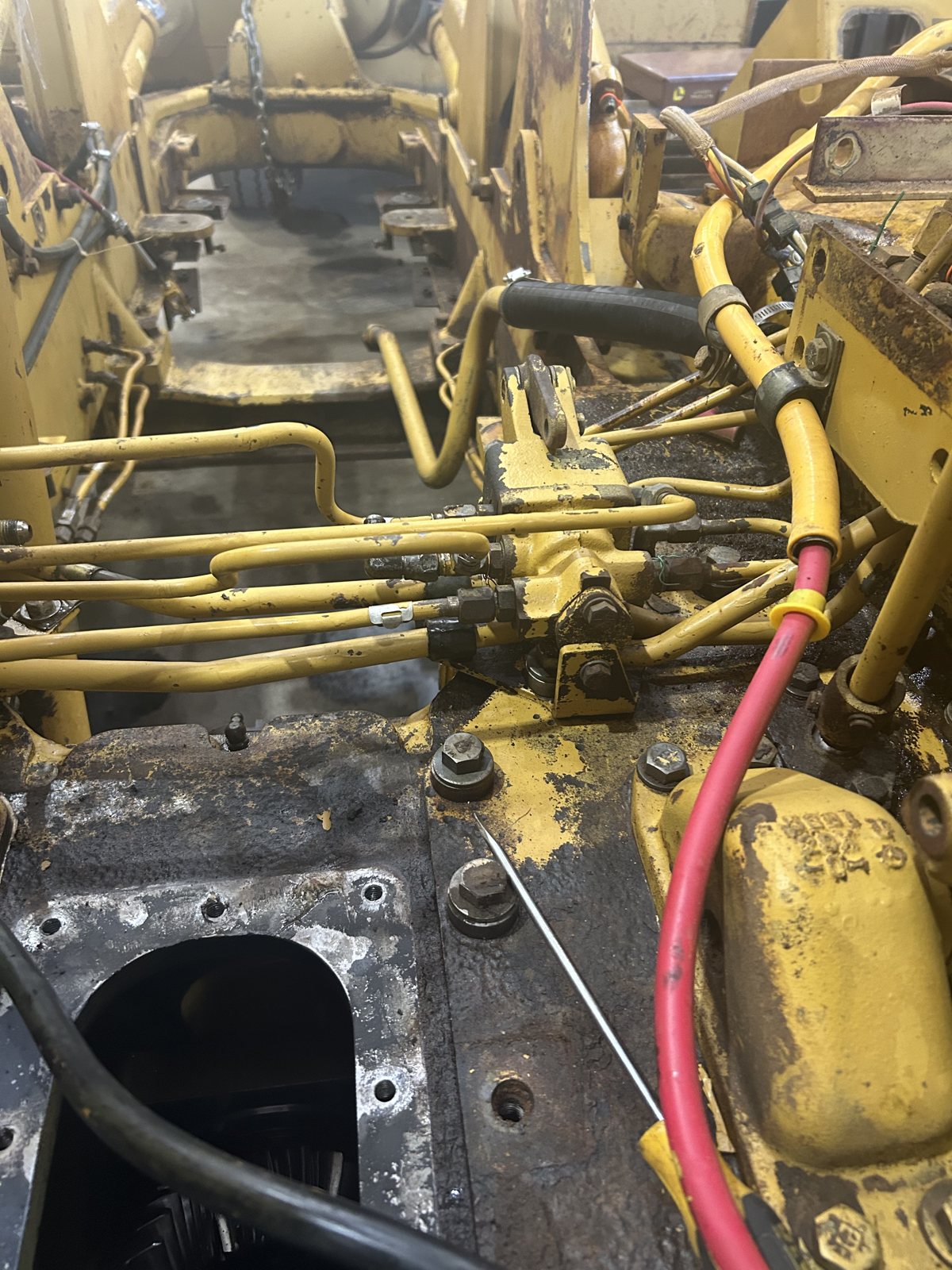 D3 dozer rebuild: plumbing and wiring under the deck.