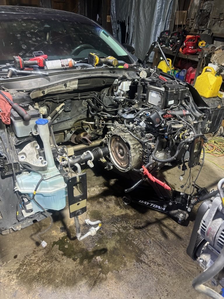 Optima engine bay from the side during removal.